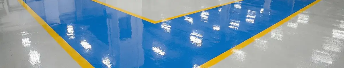 A factory floor professionally covered and marked with epoxy flooring in Pueblo, CO