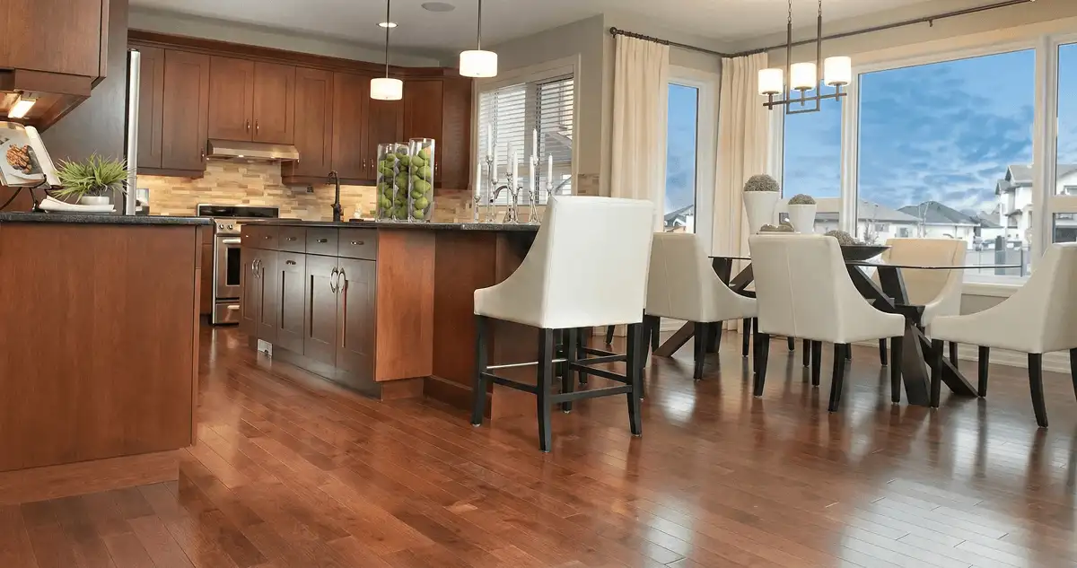A modern kitchen with professionally installed wood flooring in Pueblo, CO