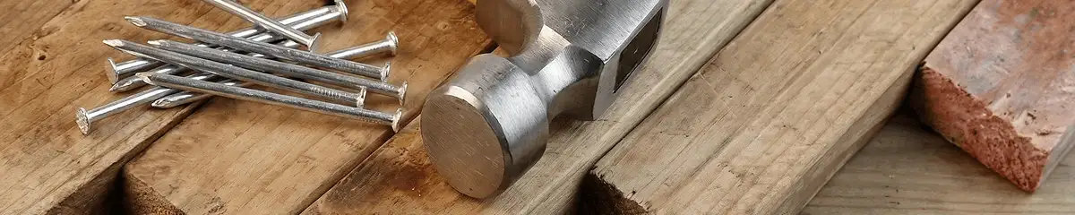 Hammer and nails on hardwood flooring boards in Pueblo, CO
