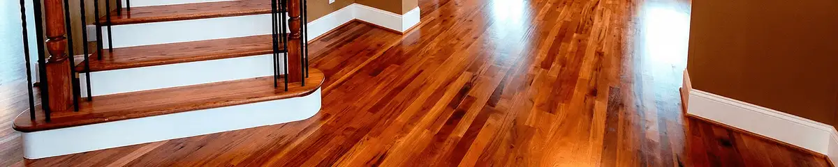Base floor of a staircase with professionally restored wood flooring in Pueblo CO