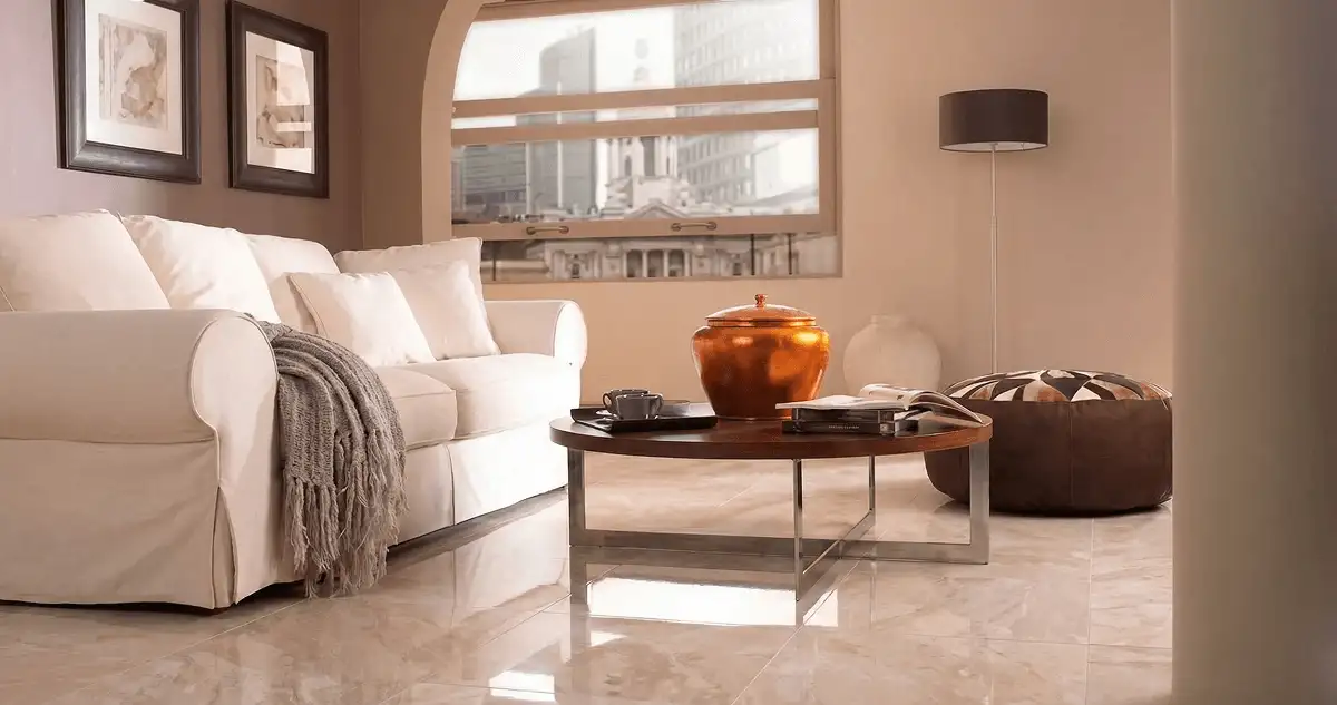 Modern living room with professionally installed marble flooring, a beige sofa, coffee table in Pueblo, CO