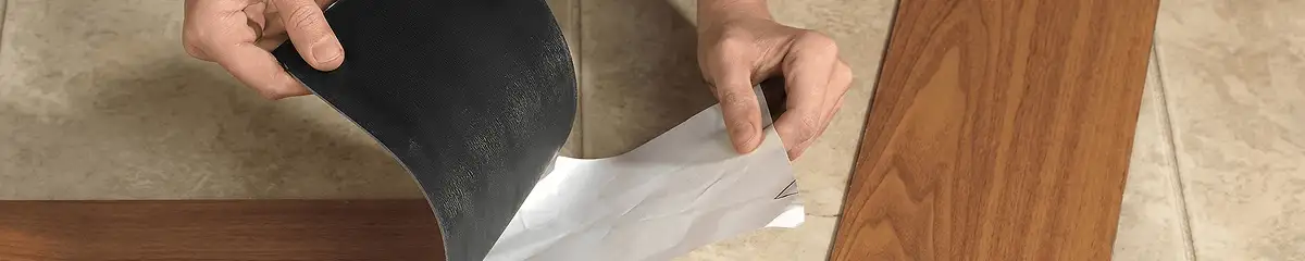 A professional installing vinyl flooring in Pueblo, CO