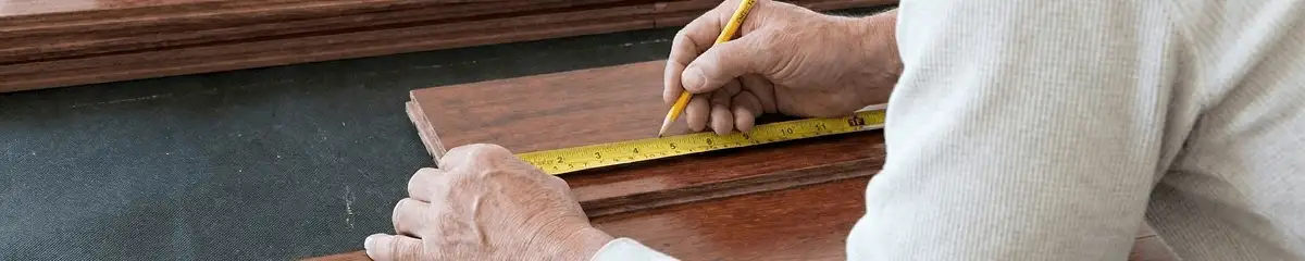 A professional installing wood flooring in Pueblo, CO